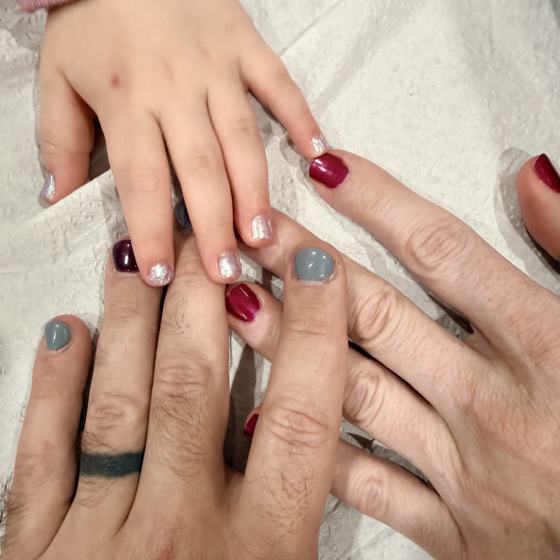 Painted nails: Mike's, his wife's, and his daughter's hands together