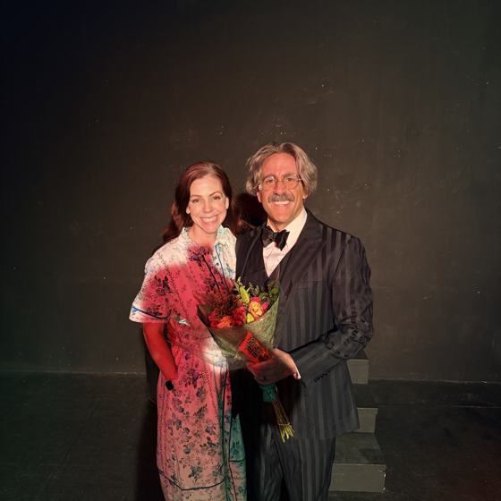 Mike in costume after a theater performance, with his wife